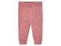 Roze gebreide leggings voor baby's.