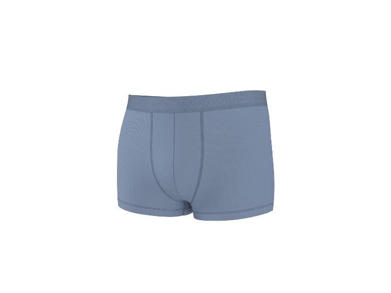 Lichtblauwe herenboxershort met geribbelde textuur en zichtbare stiksels.