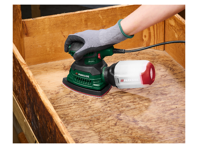 Een Parkside schuurmachine wordt gebruikt om hout te schuren.