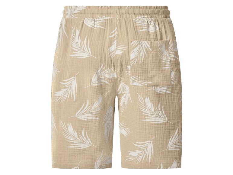 Beige linnen shorts met witte palmbladprint en elastische tailleband