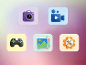 App-pictogrammen: camera, videocamera, gamecontroller, fotogalerij en instellingen.