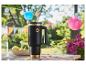 SILVERCREST® roestvrijstalen thermosbeker op een tuintafel