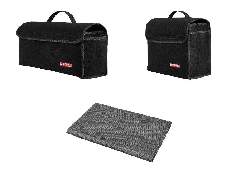 Twee zwarte Ultimate Speed opbergzakken voor de kofferbak en een grijze kofferbakmat.