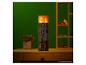 Minecraft Torch tafellamp van The Noble Collection op een houten bureau.