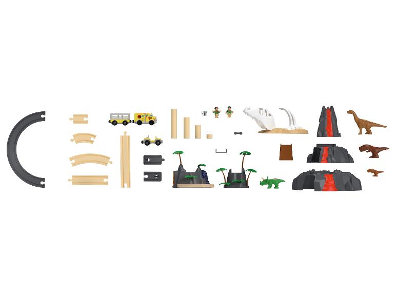 Dinosaurus-speelset met treinrails, voertuigen en figuren.