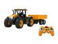 JCB radiografisch bestuurbare tractor met aanhanger.
