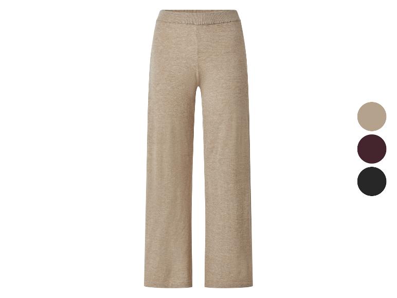 Beige gebreide broek met bordeauxrode en zwarte kleuropties.