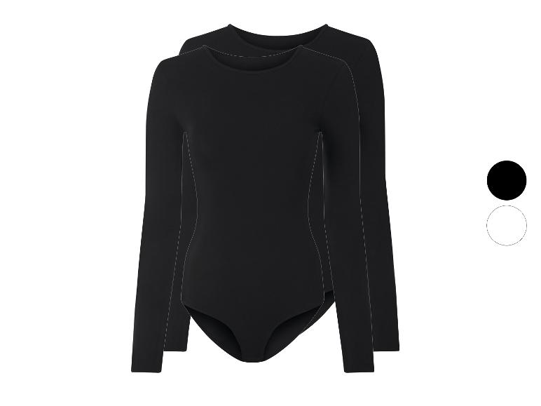 Twee zwarte bodysuits met lange mouwen en ronde hals op een witte achtergrond.