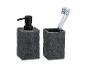 Donkergrijze zeepdispenser en tandenborstelhouder van steen.