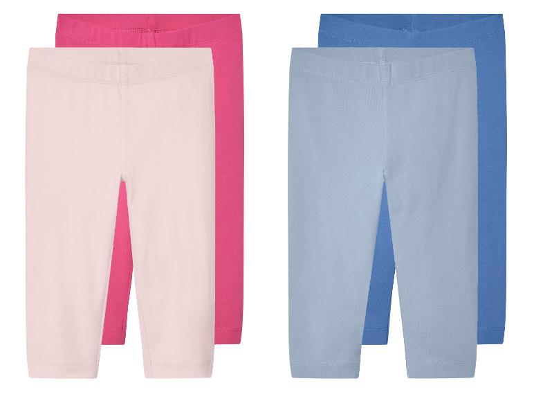 Twee paar kinder leggings in roze en lichtblauw.
