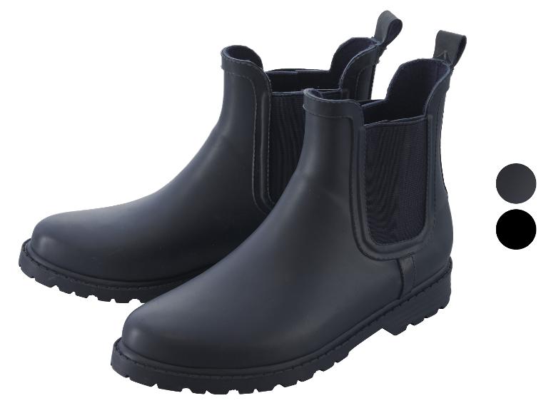 Twee paar blauwe regenlaarzen met elastische zijpanelen.