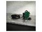 Een groene lasmachine van Telwin met een toorts en accessoires.