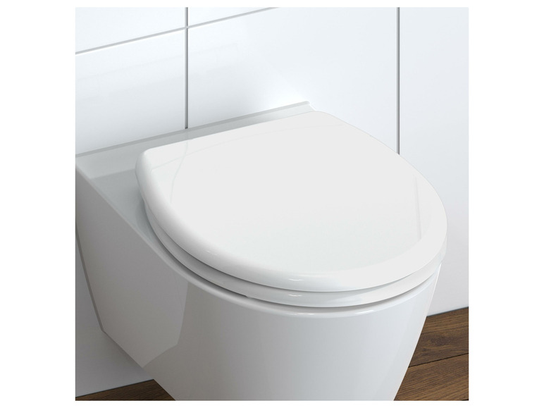 Een witte toiletbril met een modern design.