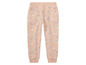 Beige broek met bloemenprint.