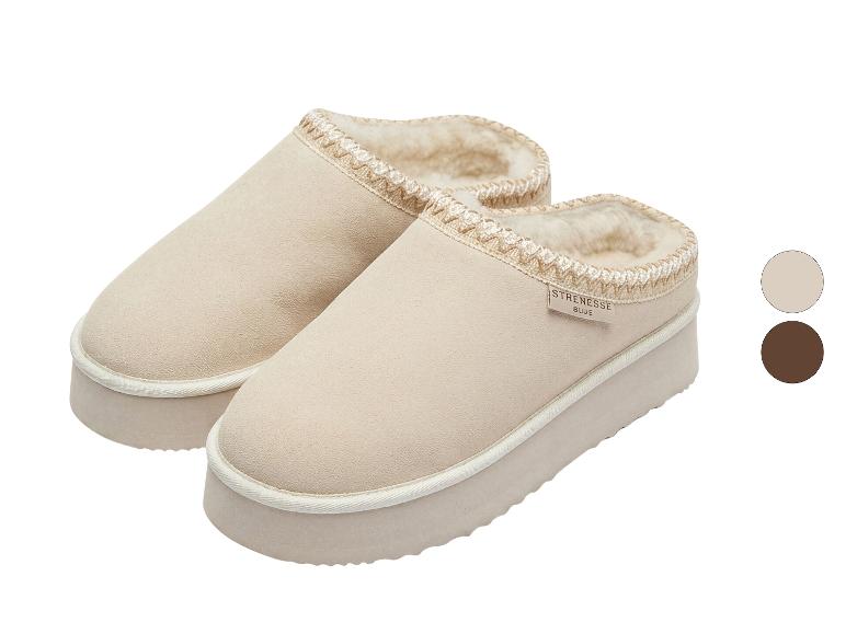 Paar beige platformslippers met imitatiebontvoering en gevlochten bies.