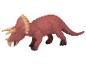 Een rood plastic triceratops speelgoeddier.