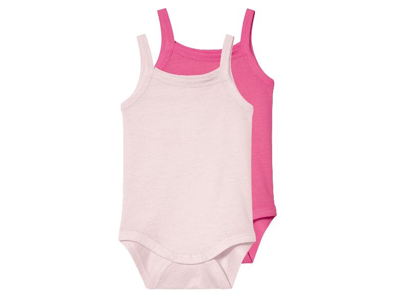 Twee baby rompertjes, lichtroze en fuchsia.