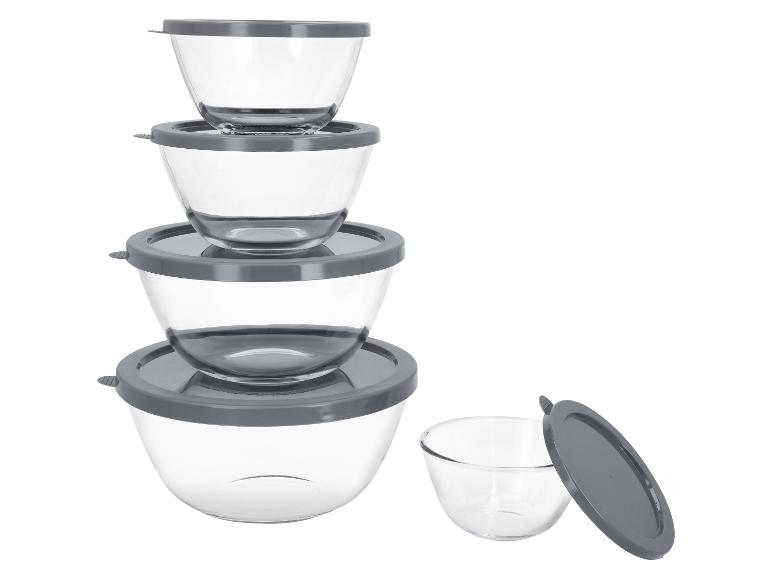 Set glazen kommen met grijze deksels, gestapeld en één ernaast.
