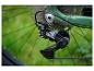 Shimano Deore achterderailleur op een groene fiets.