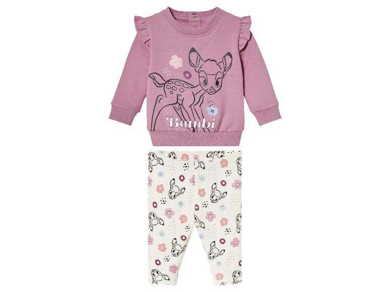 Een roze Bambi trui en witte leggings met Bambi print.