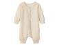 Crèmekleurig babyrompertje uit één stuk met knoopsluiting aan de voorkant