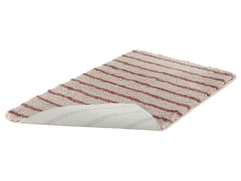 Beige en paars gestreepte badmat, met zichtbare antislip onderkant.