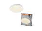 Witte ronde plafondlamp met warm licht en de verpakking ervan.