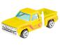 Een gele Hot Wheels Dodge pick-up truck.