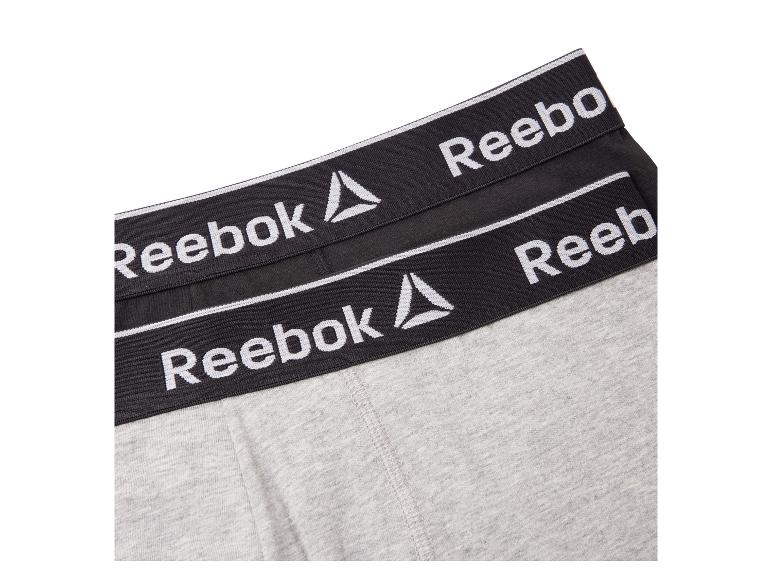Grijze en zwarte Reebok boxershorts met logo op de tailleband.