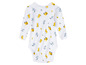 Witte baby romper met gele graafmachines en blauwe tractors