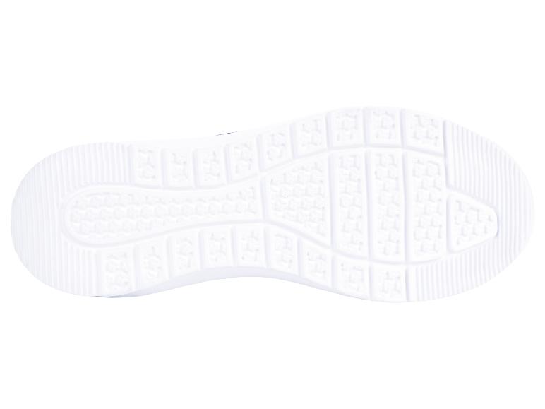 Witte zolen van sportschoenen.