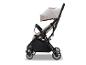 Lichtgewicht beige en zwarte kinderwagen met zonnekap en opbergmand
