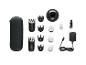 Haartrimmer set met etui, laadstation, accessoires en olie.