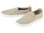 Beige canvas slip-on sneakers.