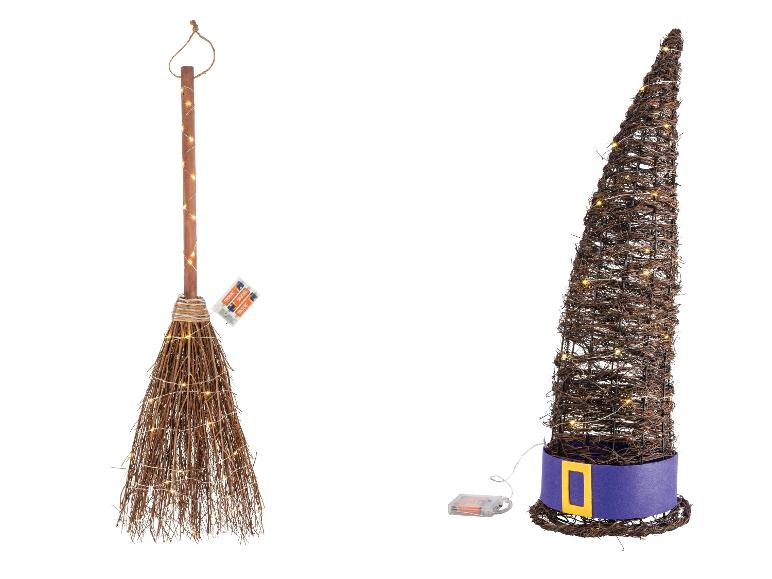 Verlichte Halloween-decoraties: bezem en heksenhoed.