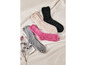 Zachte, donzige sokken in roze, grijs en beige.