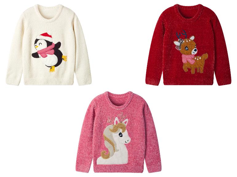 Drie kinder truien: wit met een pinguïn, rood met een rendier en roze met een eenhoorn.