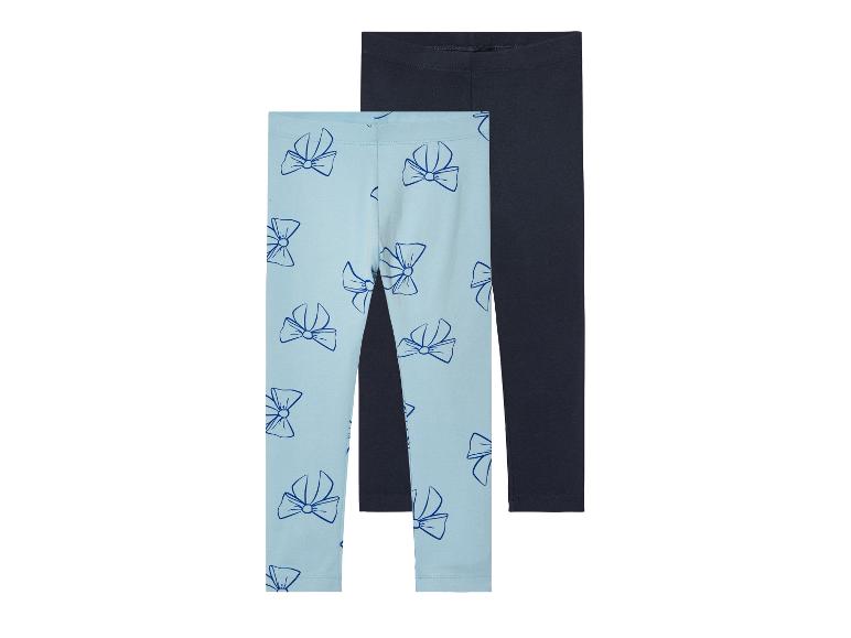 Twee leggings voor meisjes: één lichtblauw met strikjes print en één donkerblauw.