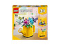 LEGO Creator 3-in-1 set met een gieter met bloemen, vogels en een laars.