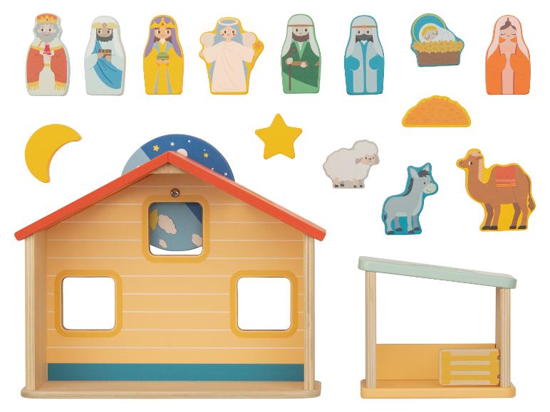 Houten kerstspeelset, inclusief een huis, een kribbe en figuren.