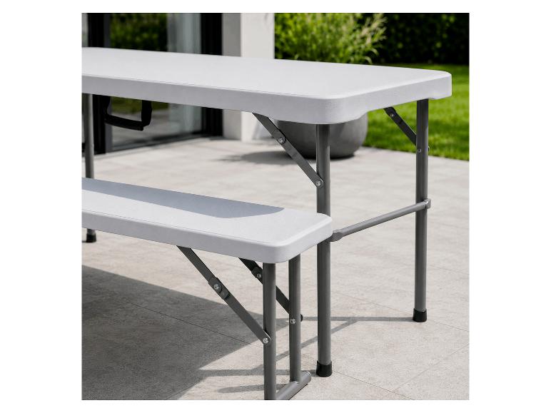Grijze opvouwbare picknicktafel met bankjes op een terras.