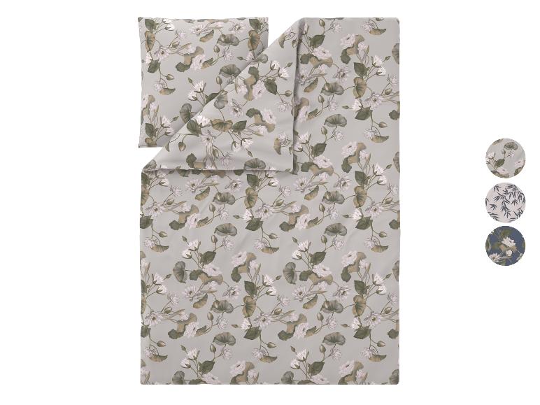 Dekbedovertrekset met een lichtgrijze achtergrond en een wit waterleliepatroon.