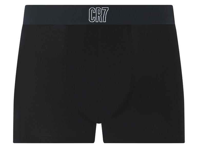 Zwarte boxershort met donkere elastische tailleband en witte tekst.