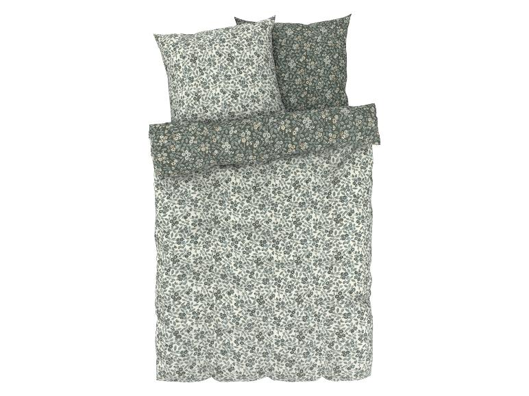 Een dekbedovertrek en kussenslopen met een bloemenprint.