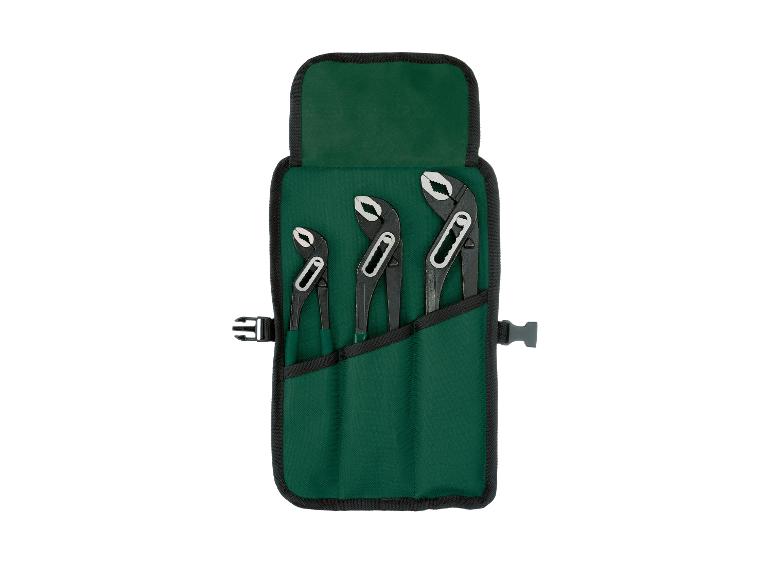 Set van drie zwarte tangen in een groene gereedschapsrol.