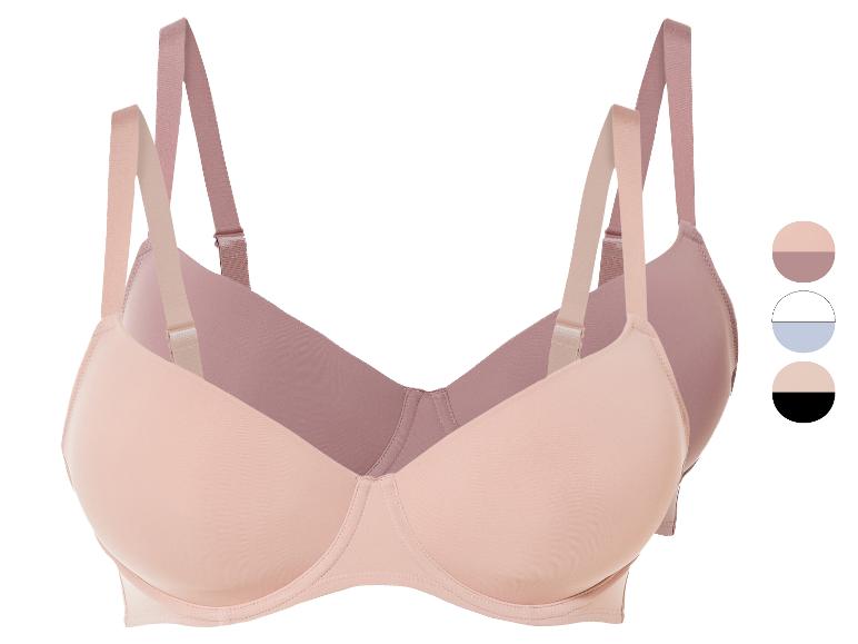 Twee naadloze bh's in roze en huidskleur.