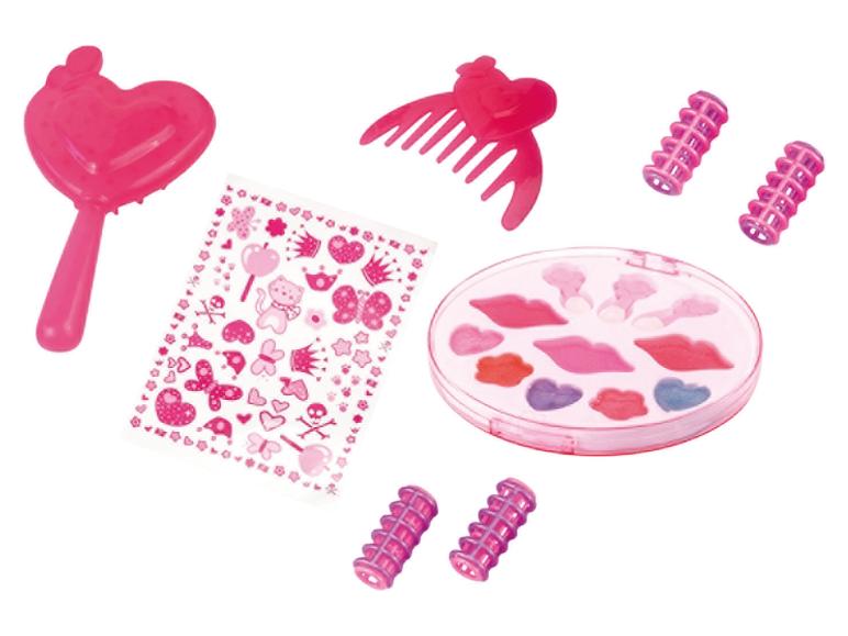 Roze speelgoed make-up set met hartvormige toverstaf, kam, krulspelden, stickers en lipgloss palet.
