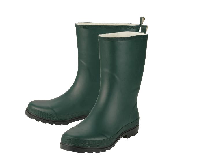 Een paar groene rubberlaarzen met witte voering