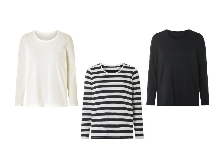 Drie shirts met lange mouwen: wit, zwart en gestreept.