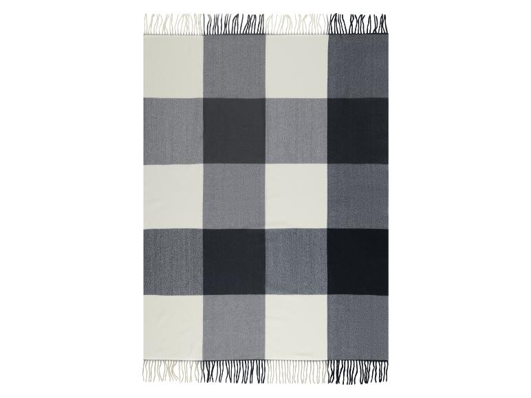 Buffalo plaid deken in wit, lichtgrijs en donkergrijs met franjes.